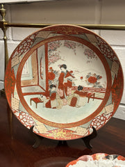 A Japanese Kutani charger signed Meiji period With A Smaller Plate
