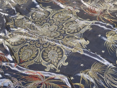 An early 20th Century large silk bed spread decorated with Middle Eastern scenes