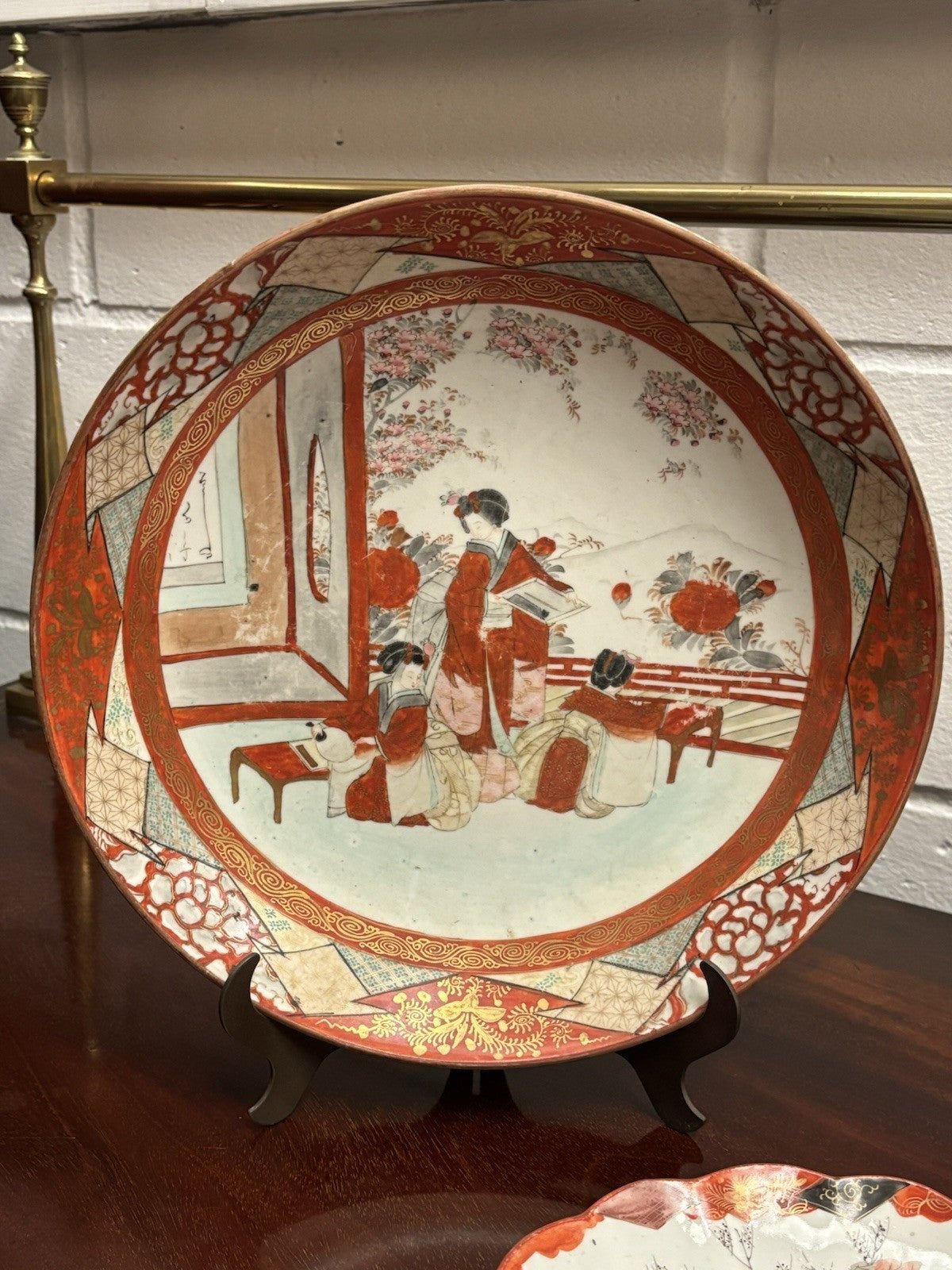 A Japanese Kutani charger signed Meiji period With A Smaller Plate