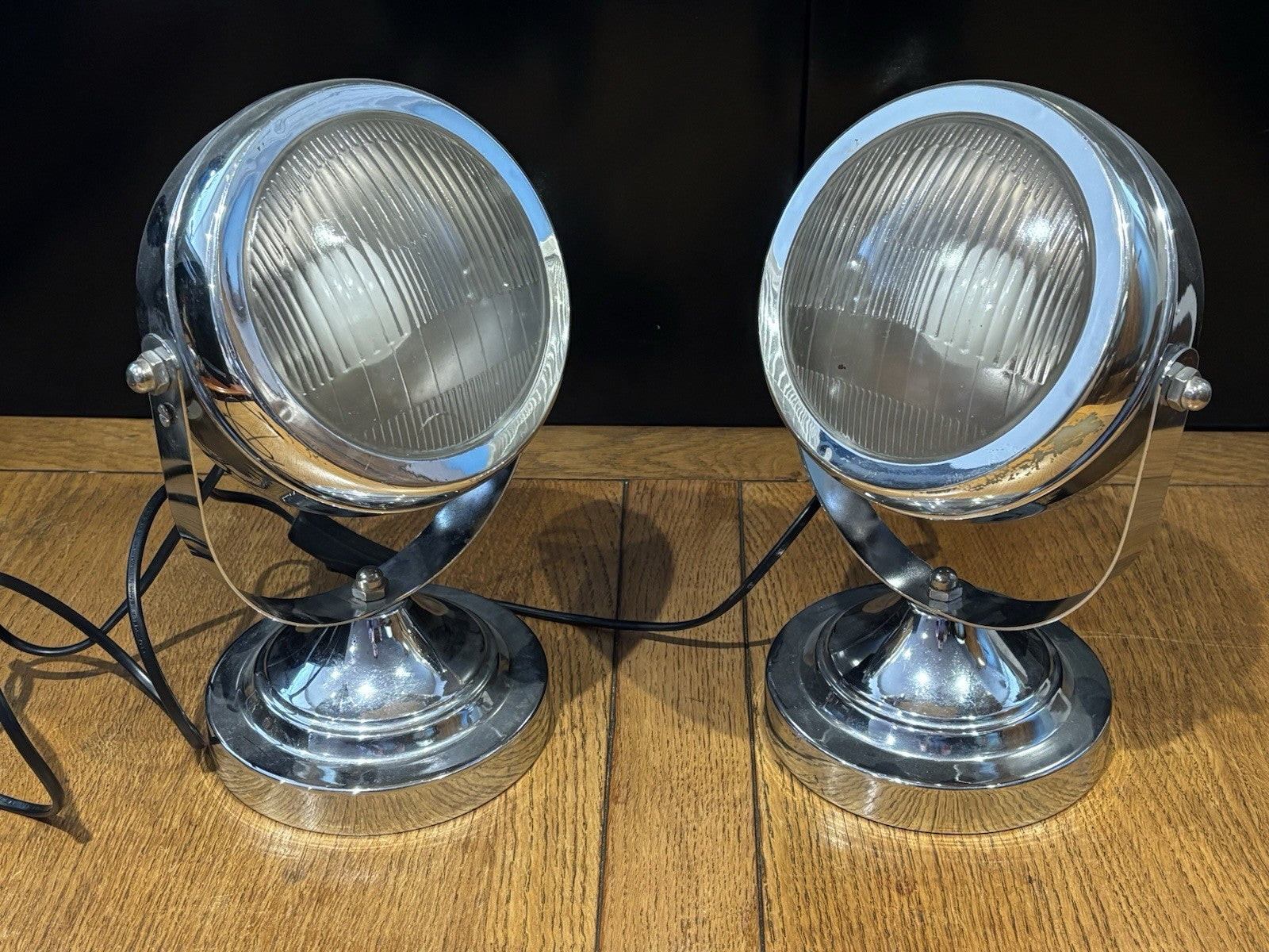 A Pair Of Adjustable Chrome Headlight Lamps