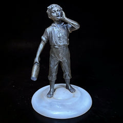 Art Deco figure on white marble base.