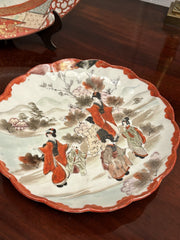 A Japanese Kutani charger signed Meiji period With A Smaller Plate