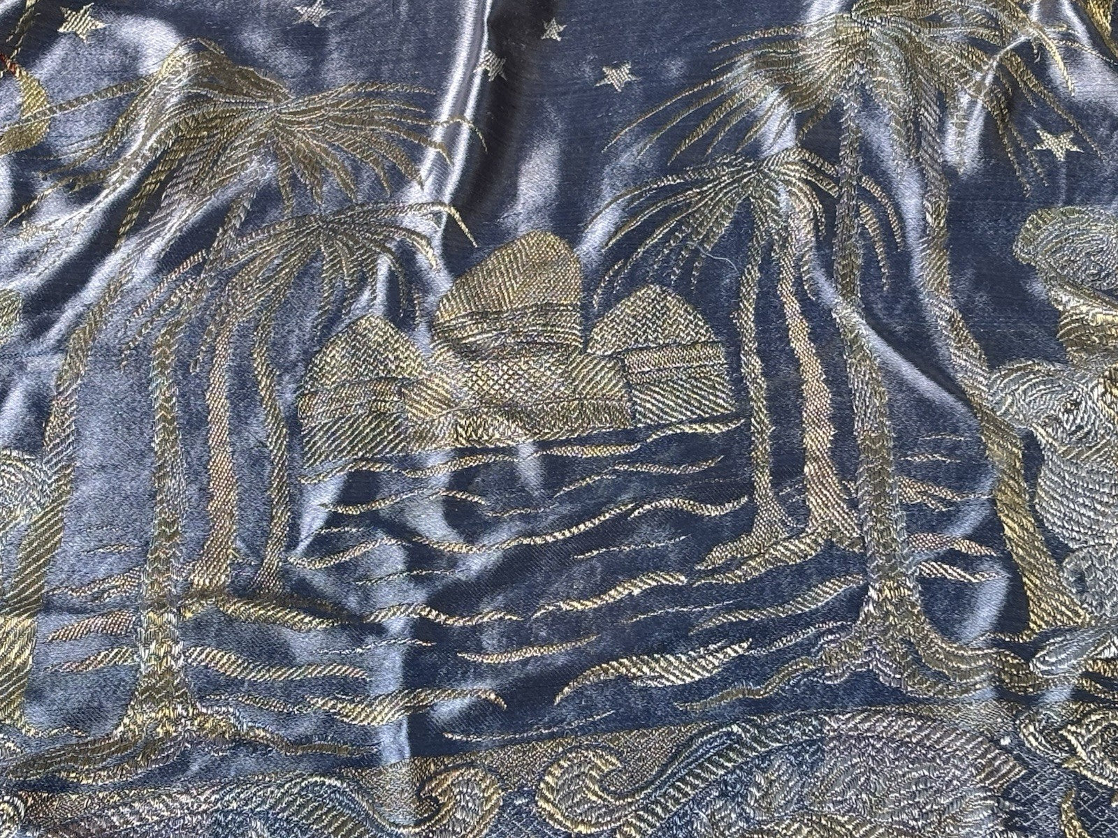 An early 20th Century large silk bed spread decorated with Middle Eastern scenes