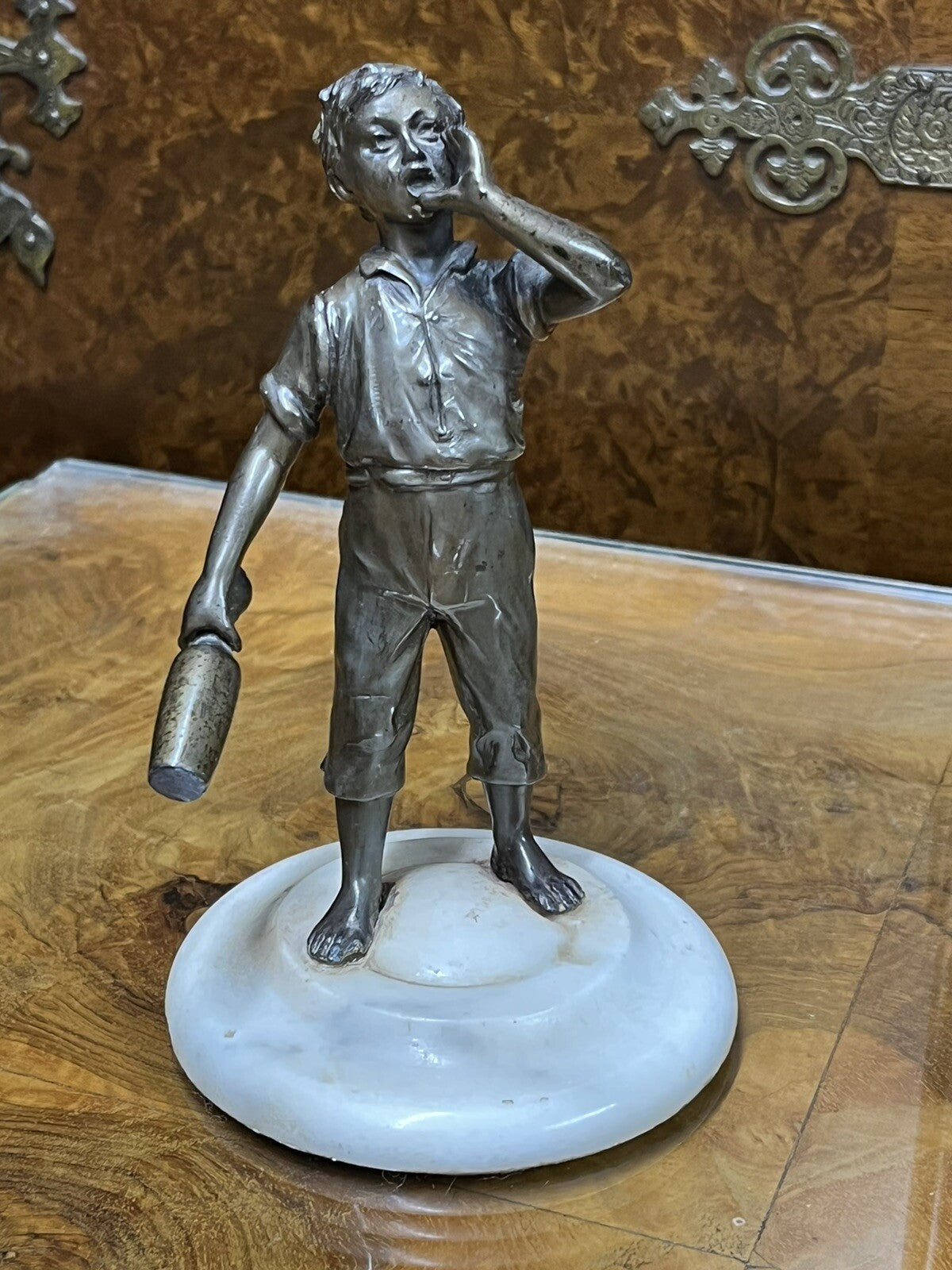 Art Deco figure on white marble base.