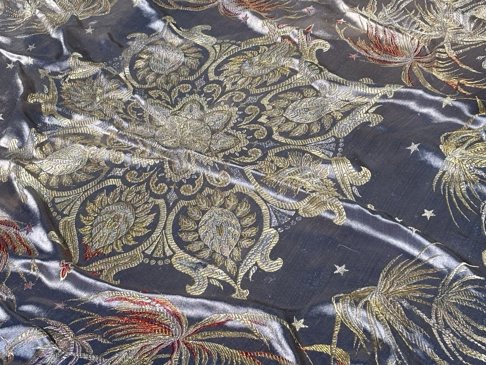 An early 20th Century large silk bed spread decorated with Middle Eastern scenes