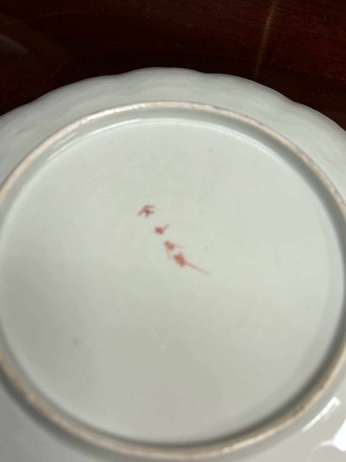 A Japanese Kutani charger signed Meiji period With A Smaller Plate