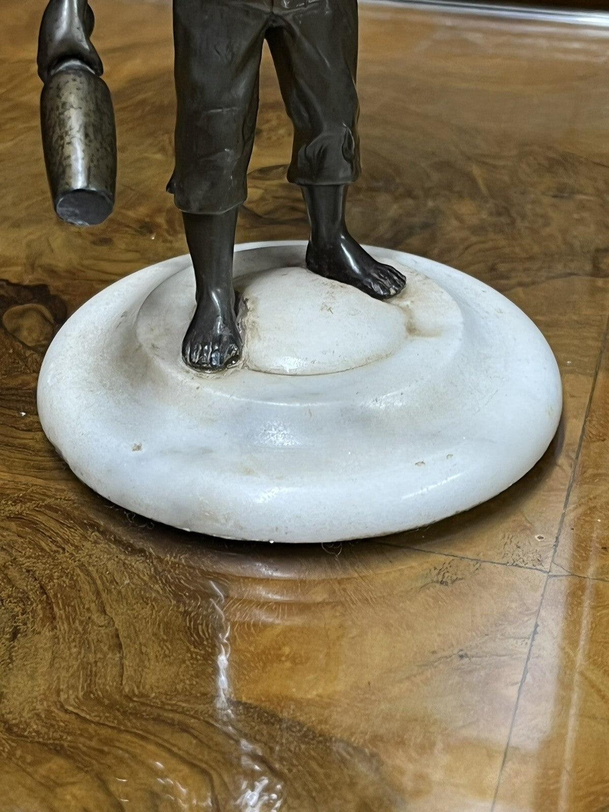 Art Deco figure on white marble base.