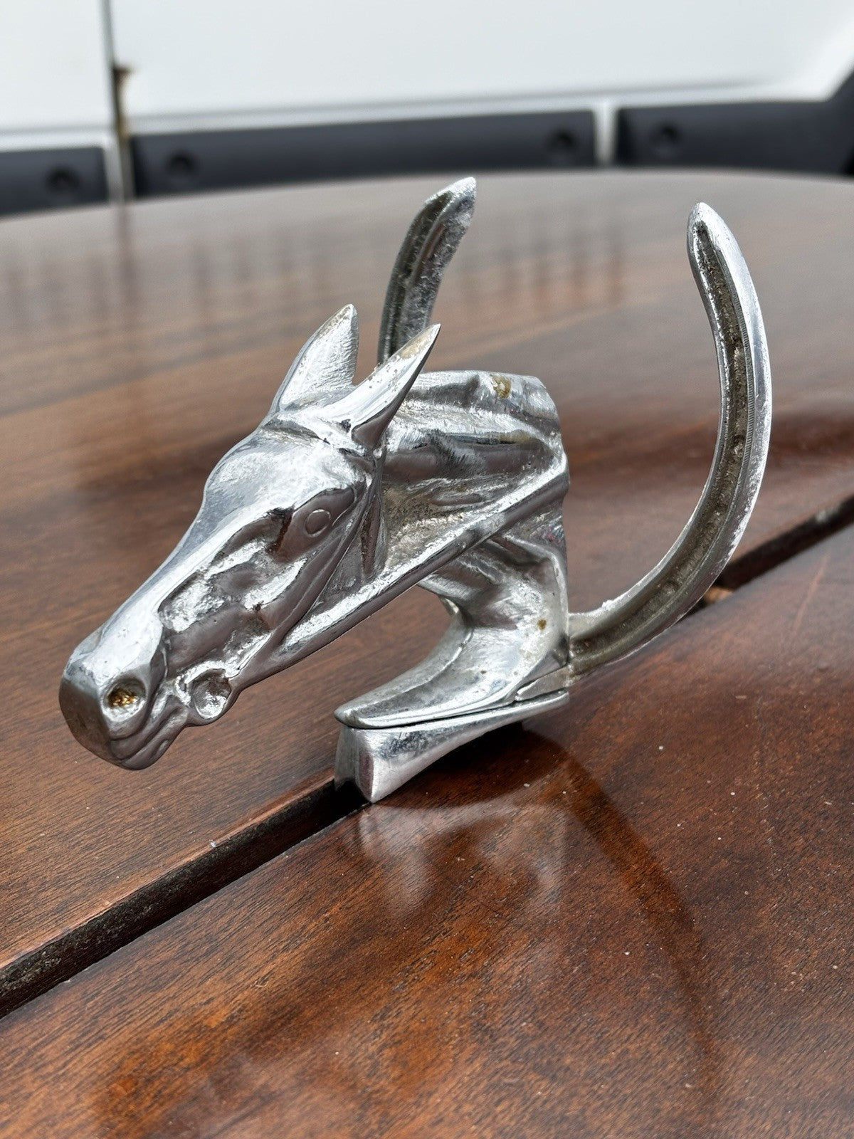 A Horse & Lucky Horse Shoe Car Mascot