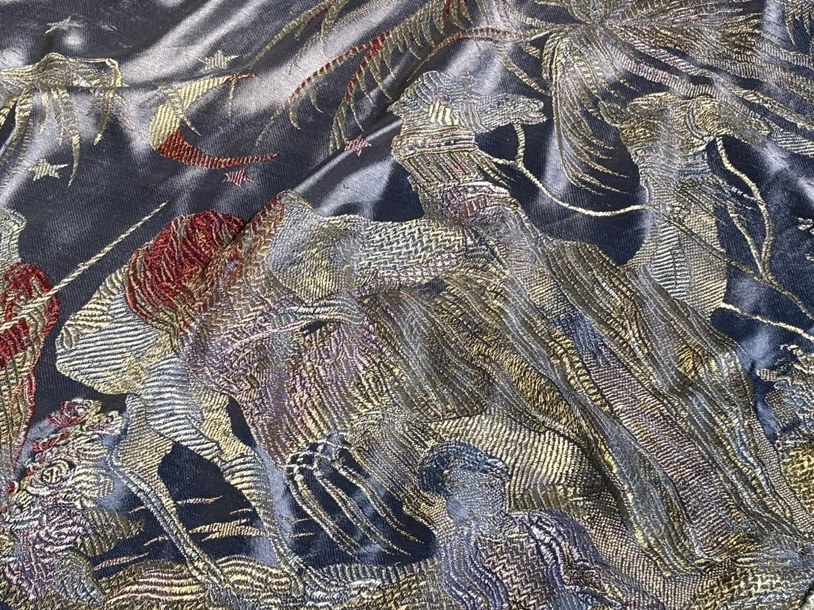 An early 20th Century large silk bed spread decorated with Middle Eastern scenes