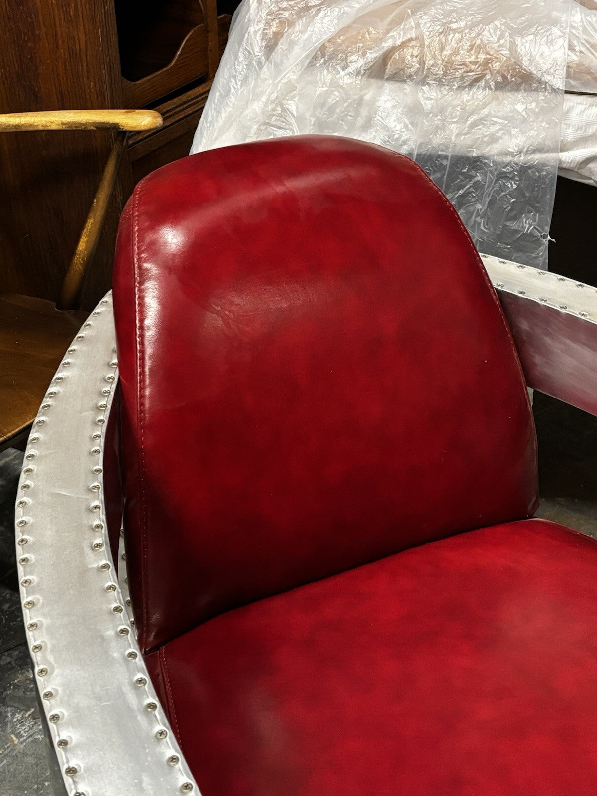 Aviators Polished Metal  Armchair, With Red Leather Upholstery.