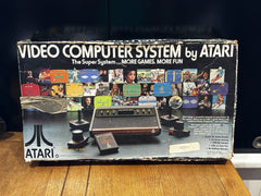 Atari 2600 With 2 joy sticks 2 paddles and 2 Games In Original Box