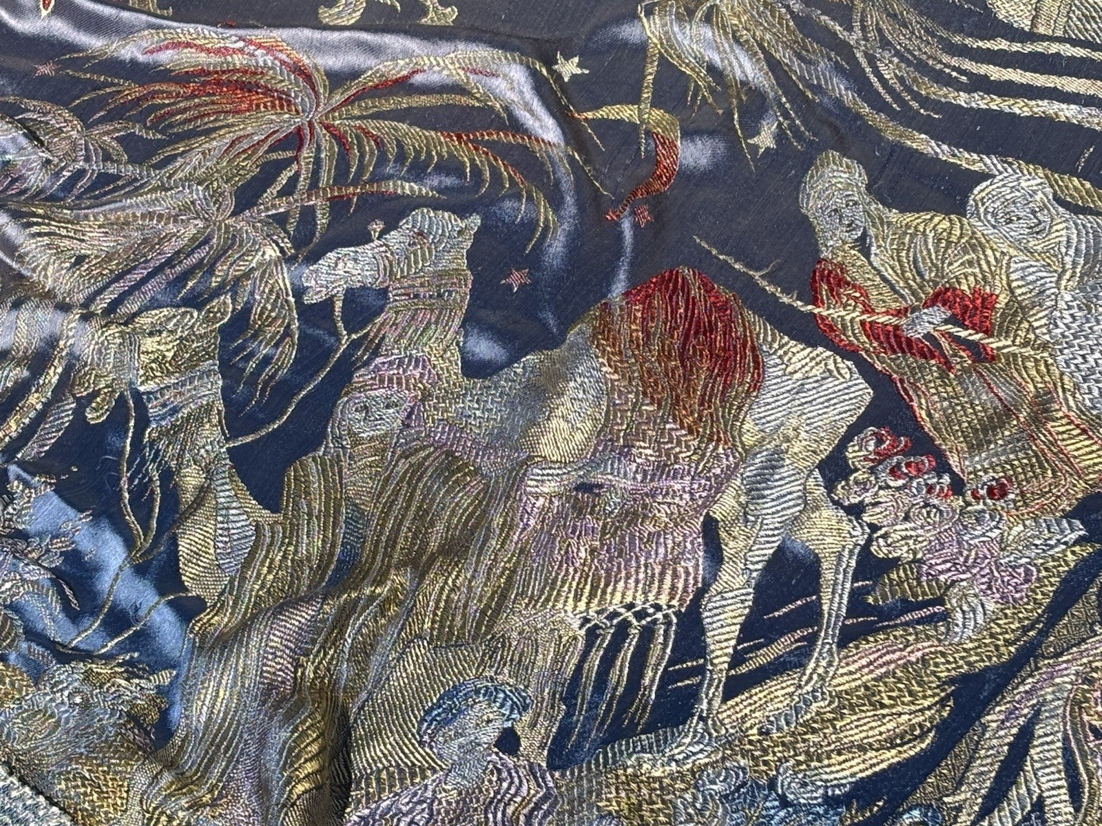 An early 20th Century large silk bed spread decorated with Middle Eastern scenes