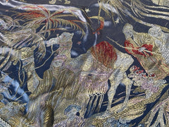 An early 20th Century large silk bed spread decorated with Middle Eastern scenes