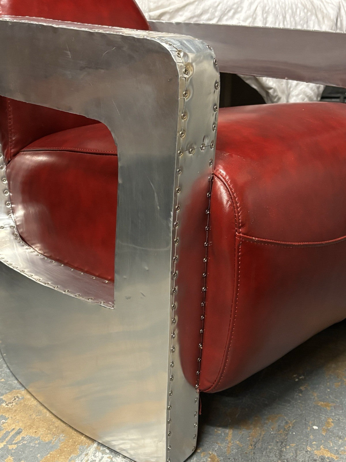 Aviators Polished Metal  Armchair, With Red Leather Upholstery.