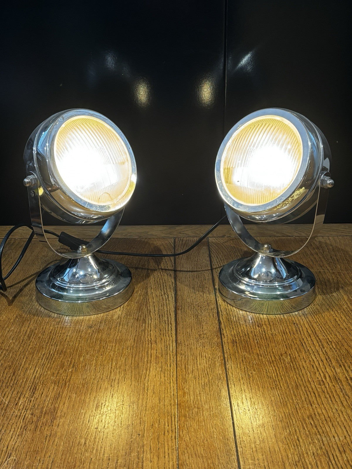 A Pair Of Adjustable Chrome Headlight Lamps