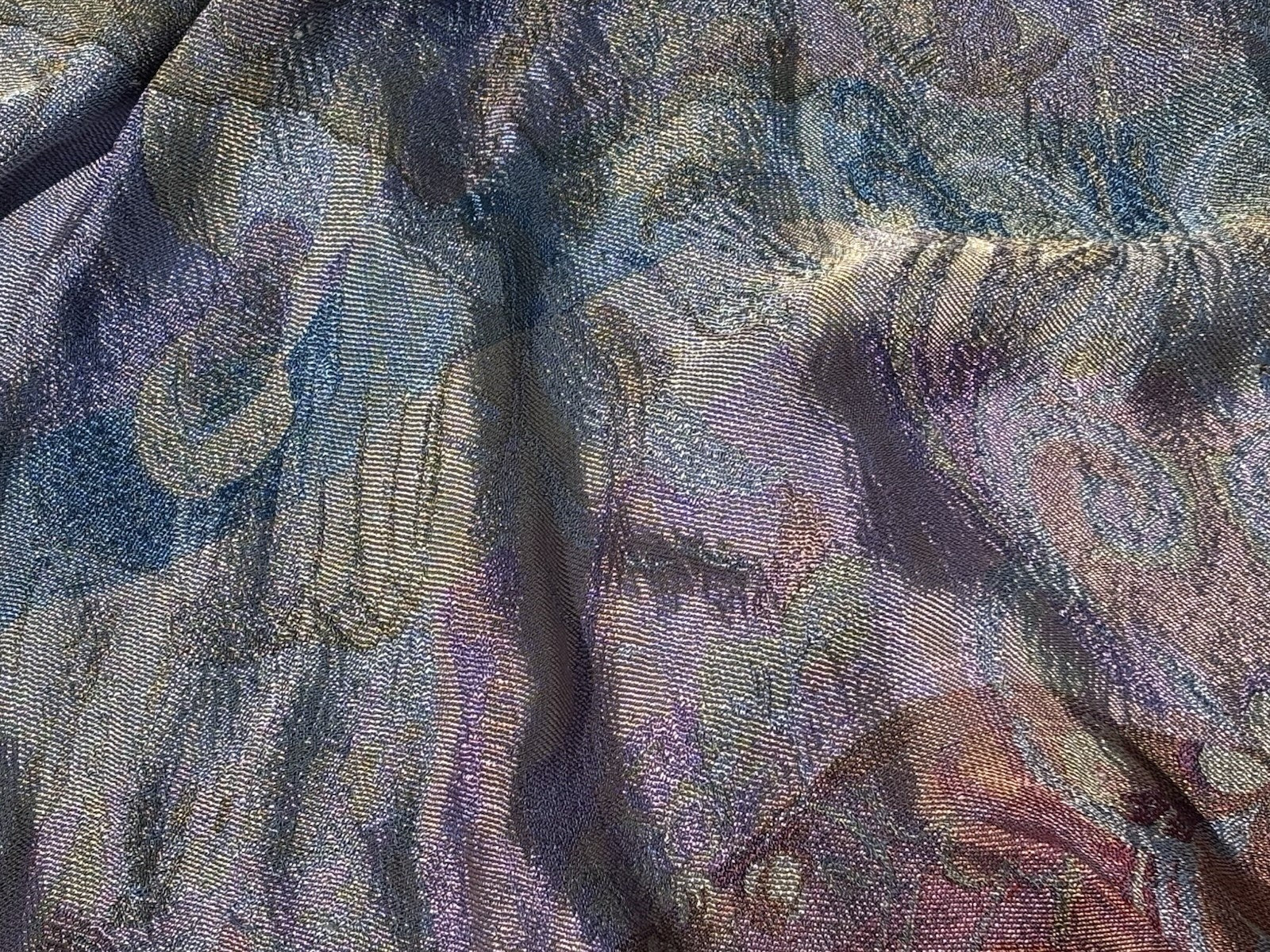 An early 20th Century large silk bed spread decorated with Middle Eastern scenes